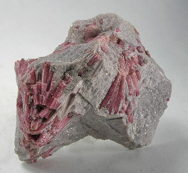 Pink tourmaline specimen in matrix